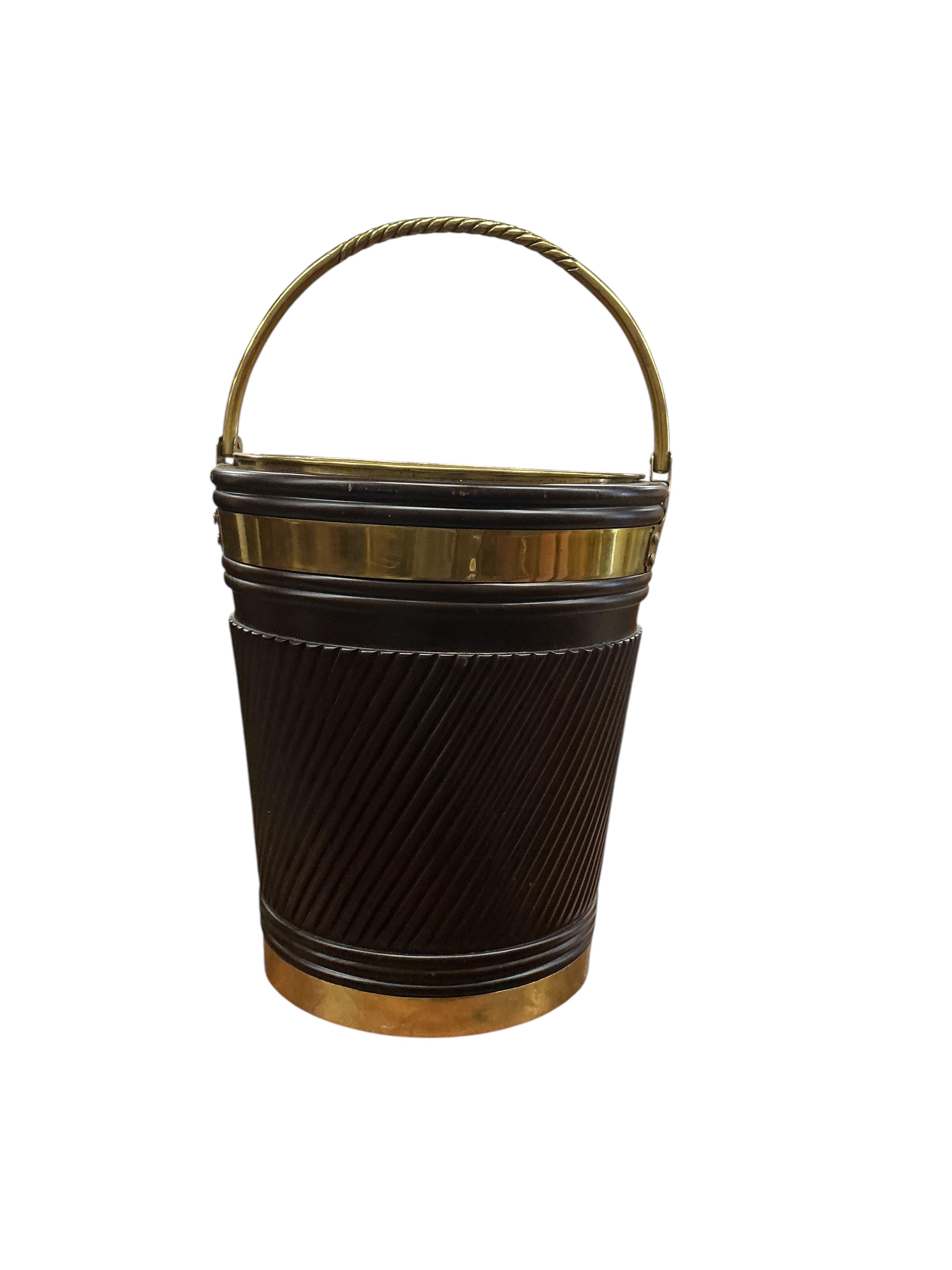 A large reproduction George III Irish style brass bound mahogany peat bucket with brass liner, diameter 46cm, height 53cm